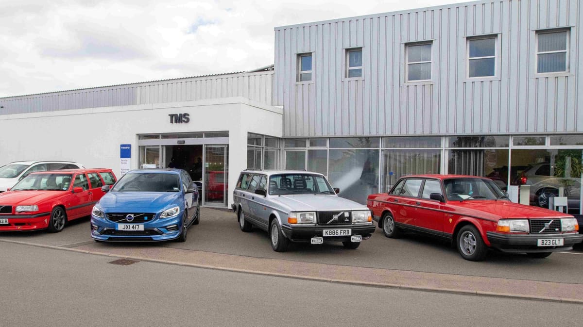 Classic and modern Volvo cars outside the TMS Volvo showroom in Hinckley